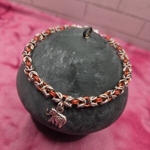853. Silver Tone and Orange Byzantine Chainmaille Bracelet With Elephant Charm